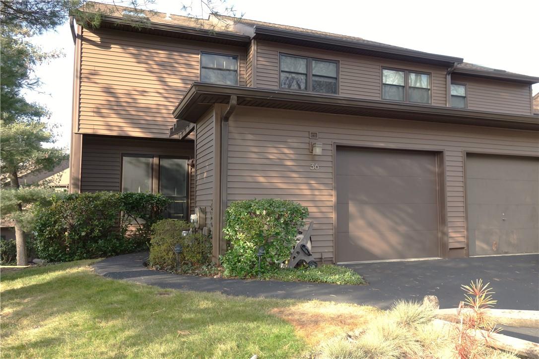 Sunny end unit at The Woods with an attached garage