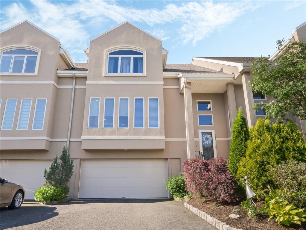 View of property with a garage