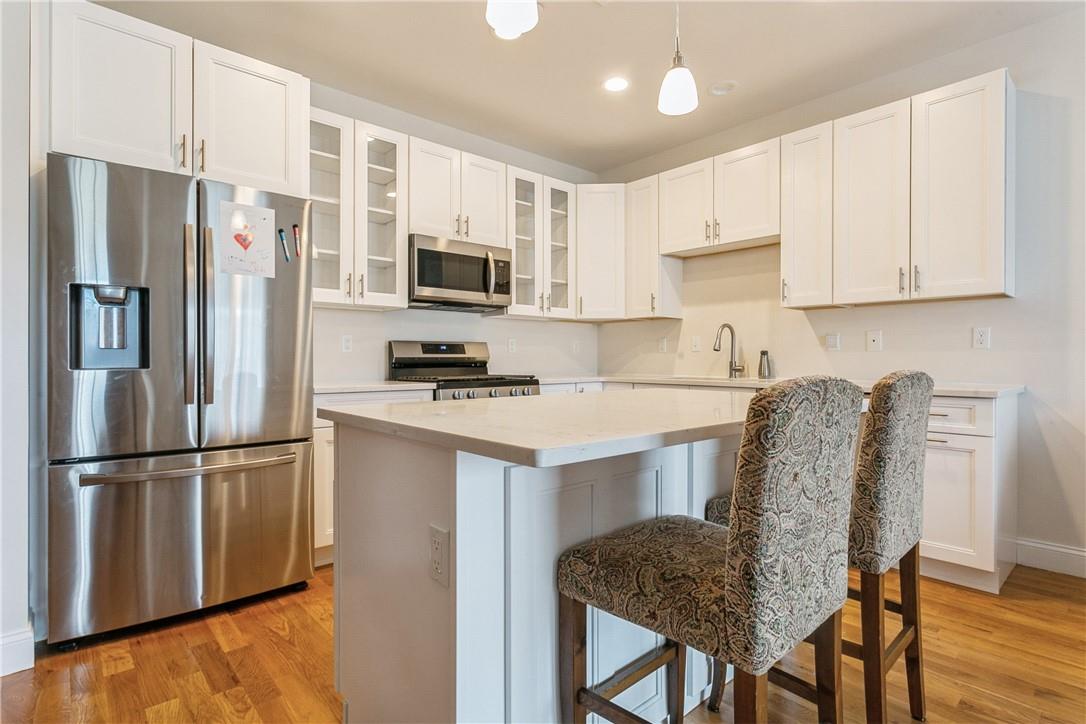 Kitchen with Island and Stainless Steel Appliances