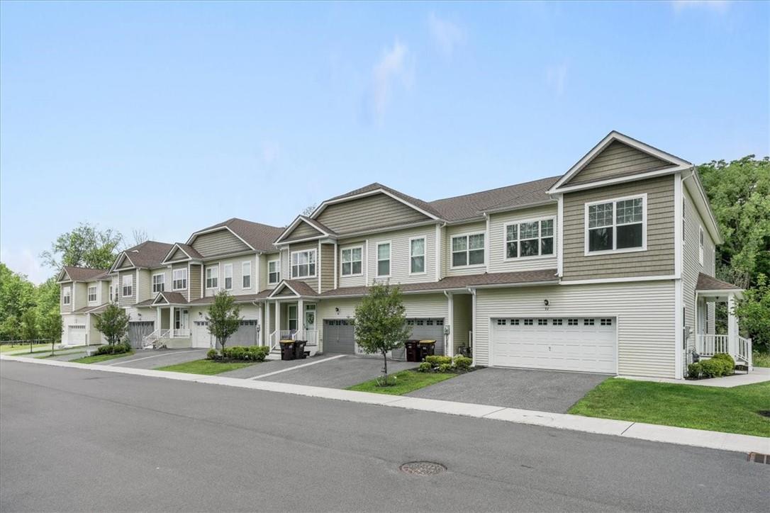 View of property featuring a garage