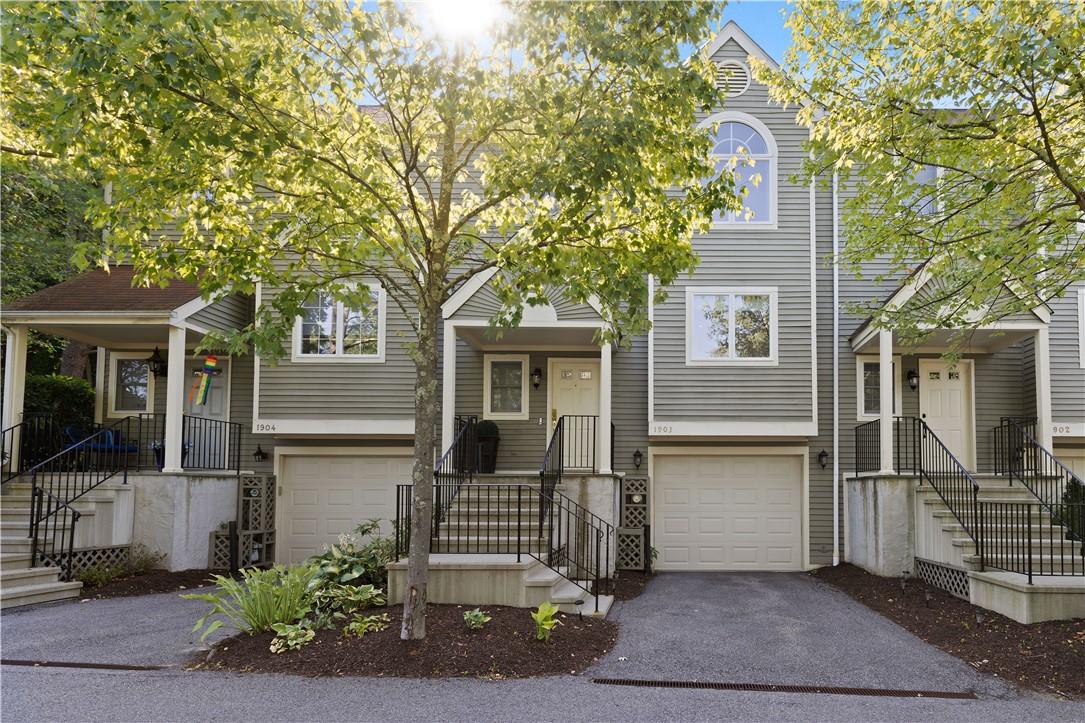 View of front of property featuring a garage