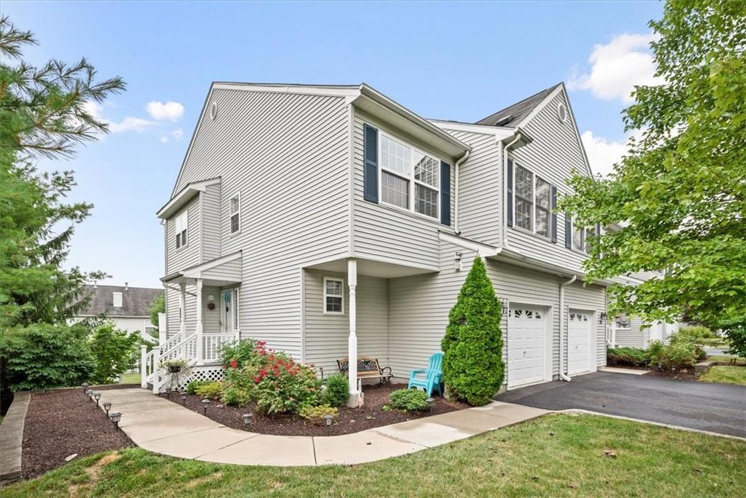 View of front of property featuring a garage