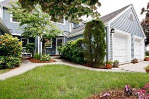 Landscaped Entrance Walkway and Attached One Car Garage.