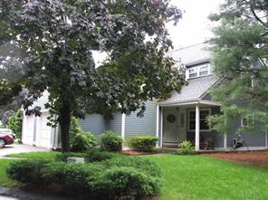 Lovely end unit with covered porch.