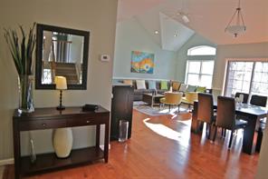 Entrance to Living Room and Dining Room.  Notice the cathedral ceilings and gleaming wood floors!