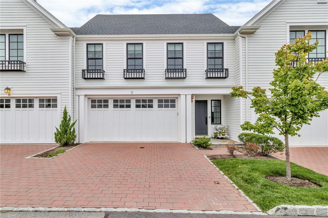 View of front of property featuring a garage