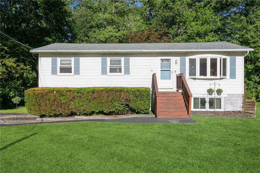 View of front of home with a front yard