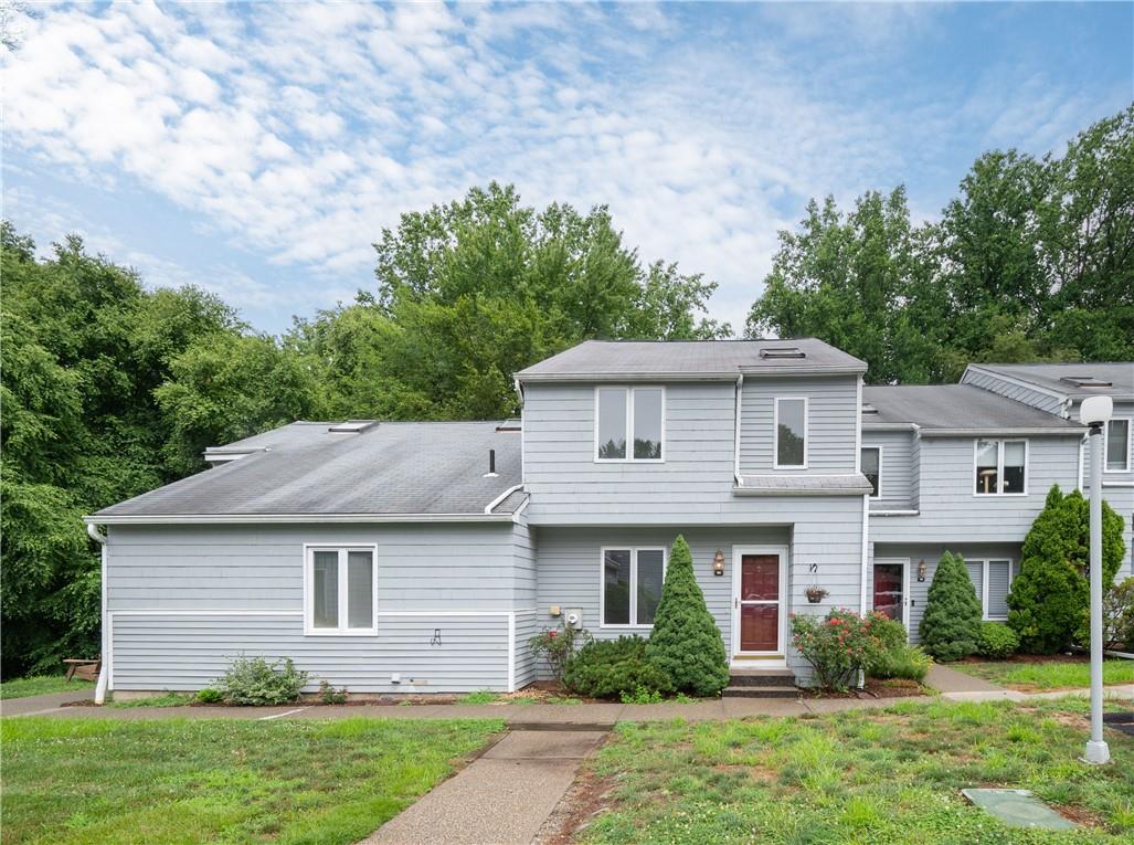 View of front of property with a front lawn