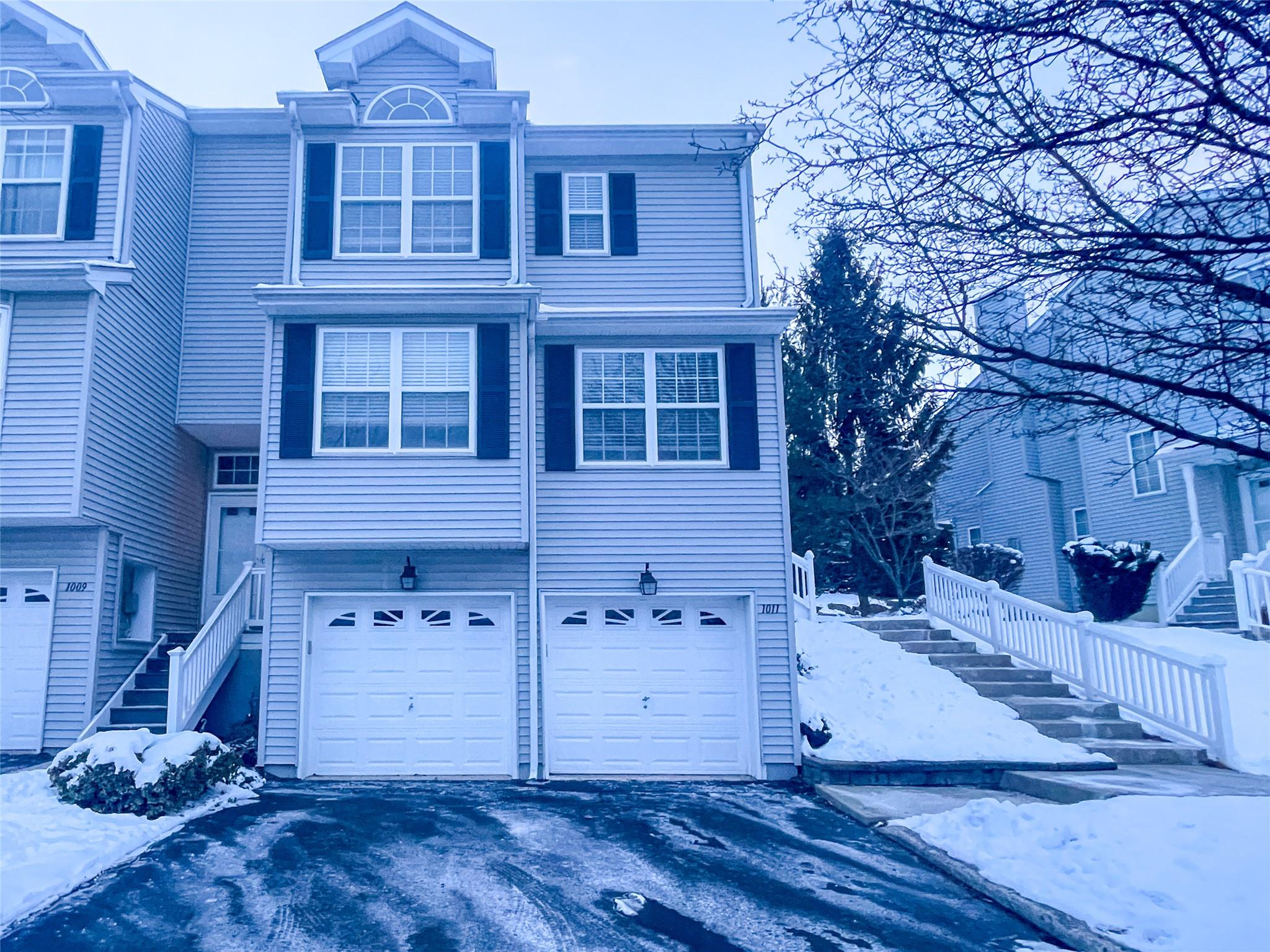 View of front of home featuring a garage