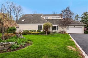 Professionally landscaped property, Front Exterior View with Belgian Block border on Driveway