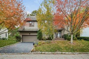 FREESTANDING detached maintenance free townhome with private rear yard/deck