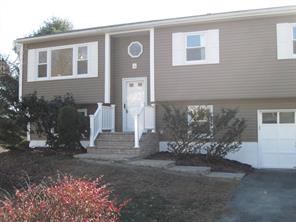 Front view of home.  More landscaping to be done, older shrubs being removed and mulch being added.