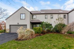 Easy living end unit townhome with attached two car garage, driveway and overnight parking