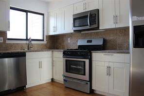 Beautifully updated New Kitchen with Granite & New Bamboo floors