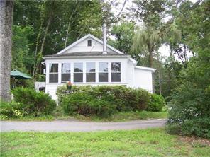 Exterior Front : sitting just steps from the sandy beach at Lake Osiris