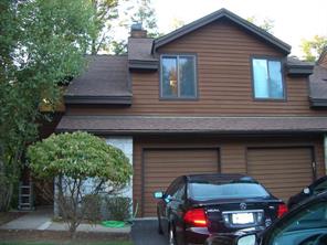 Front of home with one car garage and driveway parking.