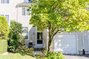 155 Winchester Ashley Model showcasing low maintenance well-manicured grounds leading to entrance.
