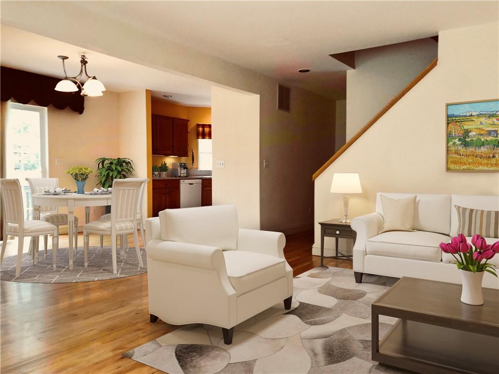 Virtually staged photo of Living Room & Dining area.