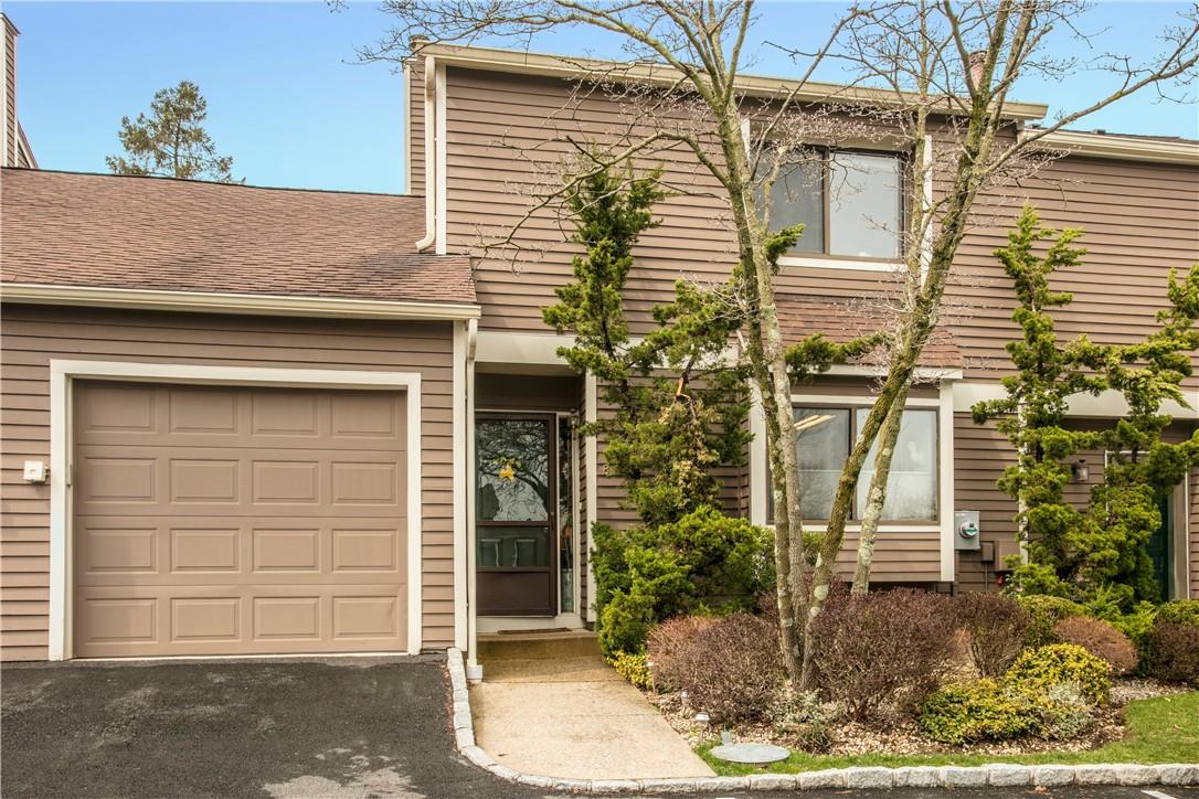 Front view with one car attached garage.