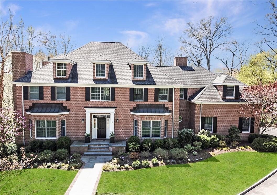 Welcome to 9 Turtleback Way! Front view of this beautiful brick-faced 5 bedroom Colonial.