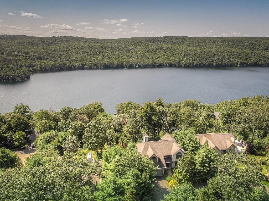 The view from this luxuriously nature set Tuxedo, private association home graces inhabitants and guests with stunning panoramic views of Sterling Lake and the mountains in the distance.