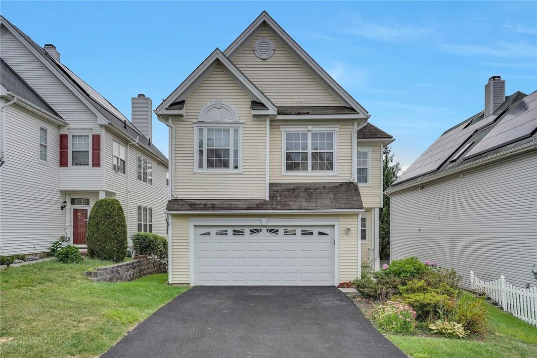 Sun filled Tri-level colonial home on level lot.