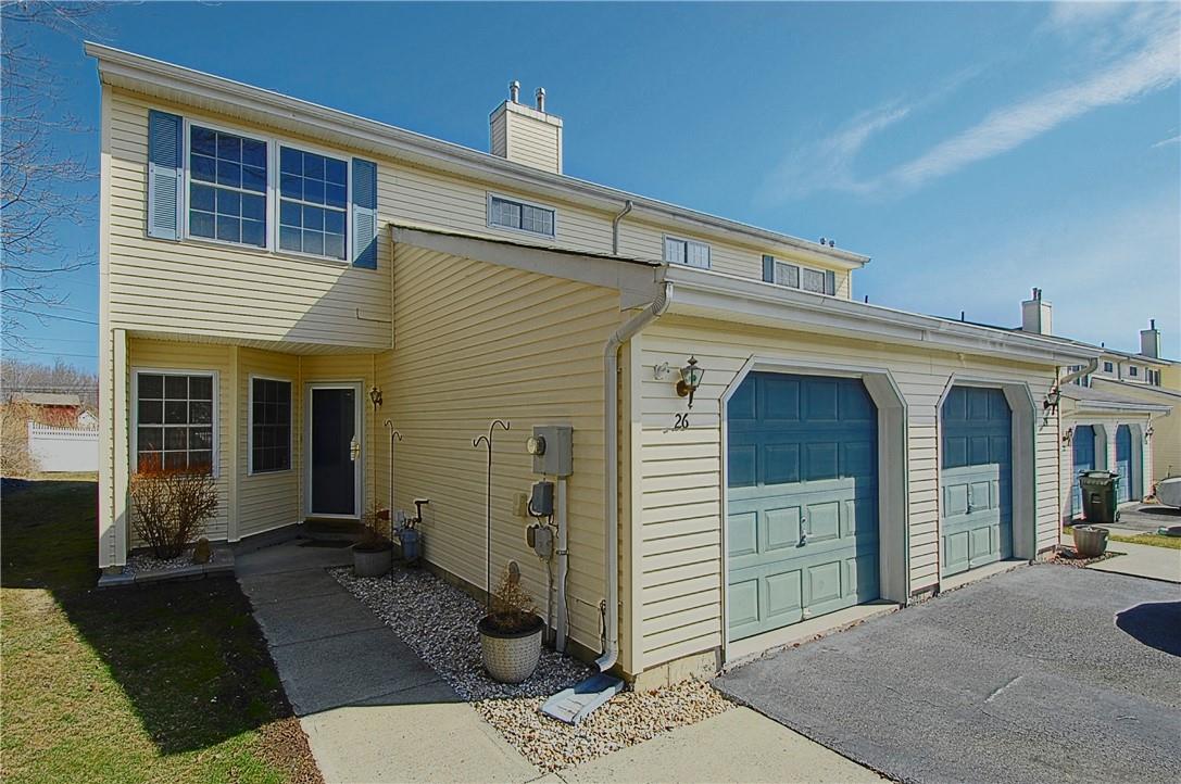 Private, vinyl sided end unit with side and back yard, 1 car garage & driveway space for 2 cars