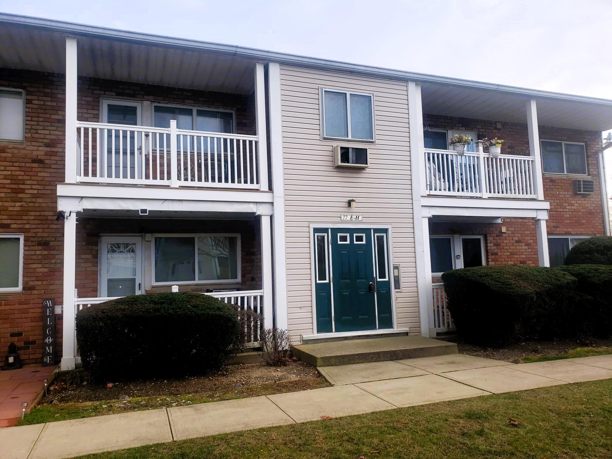 Townhome / multi-family property with a balcony