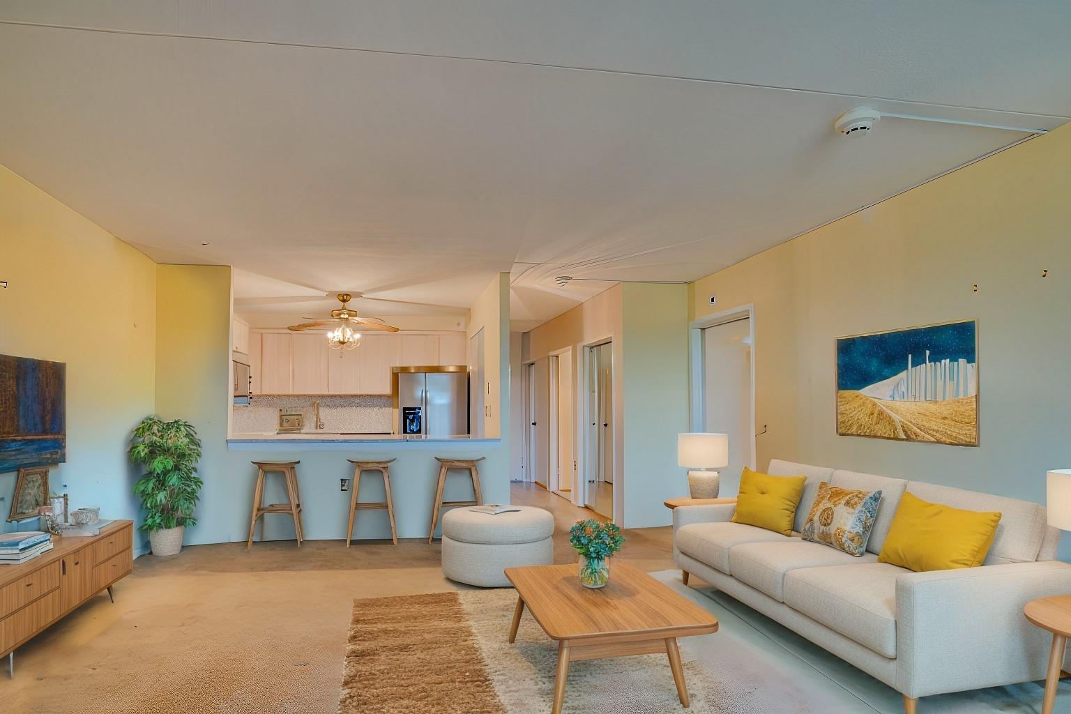 Carpeted living room featuring ceiling fan