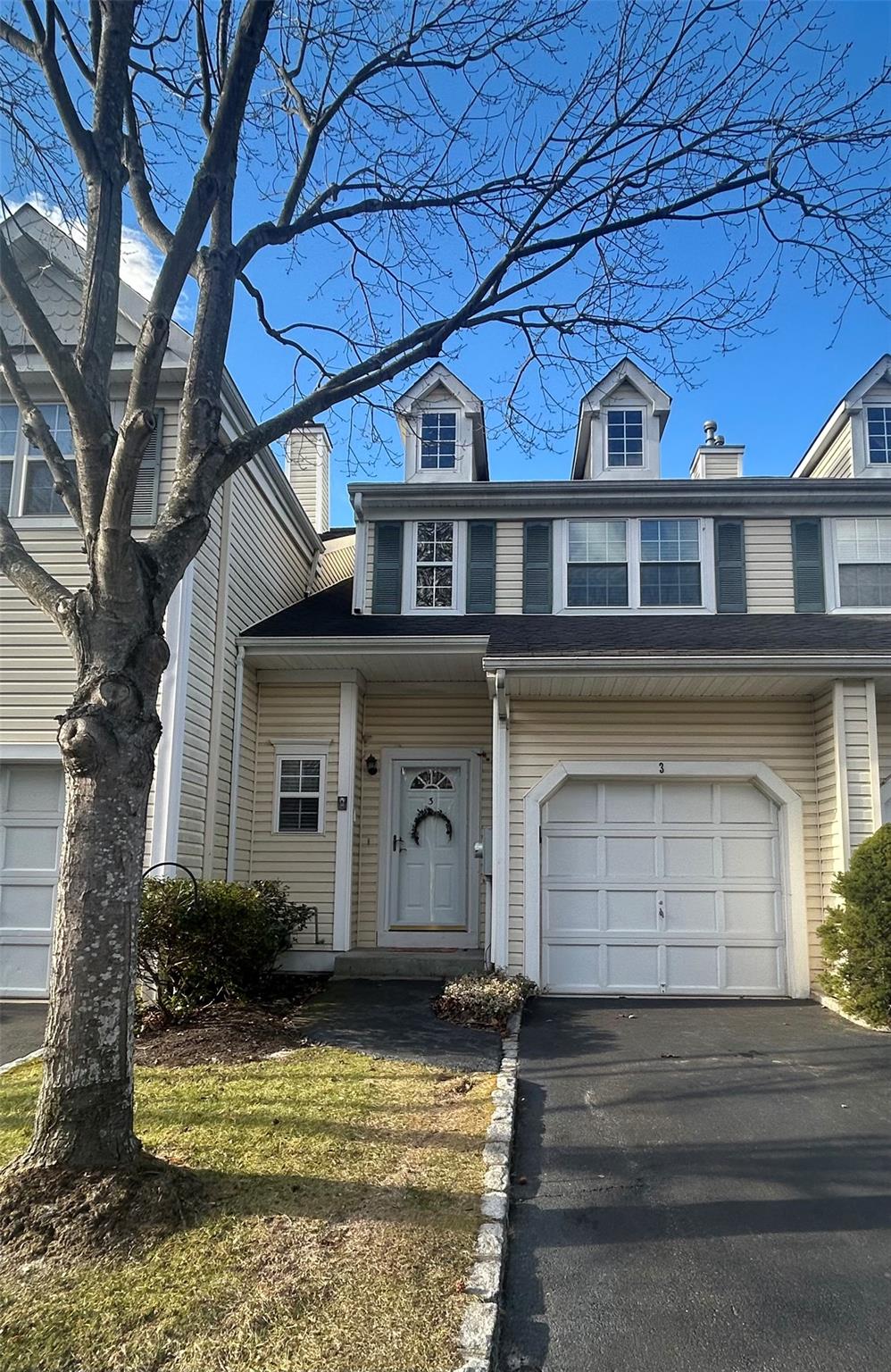 View of front of home featuring a garage
