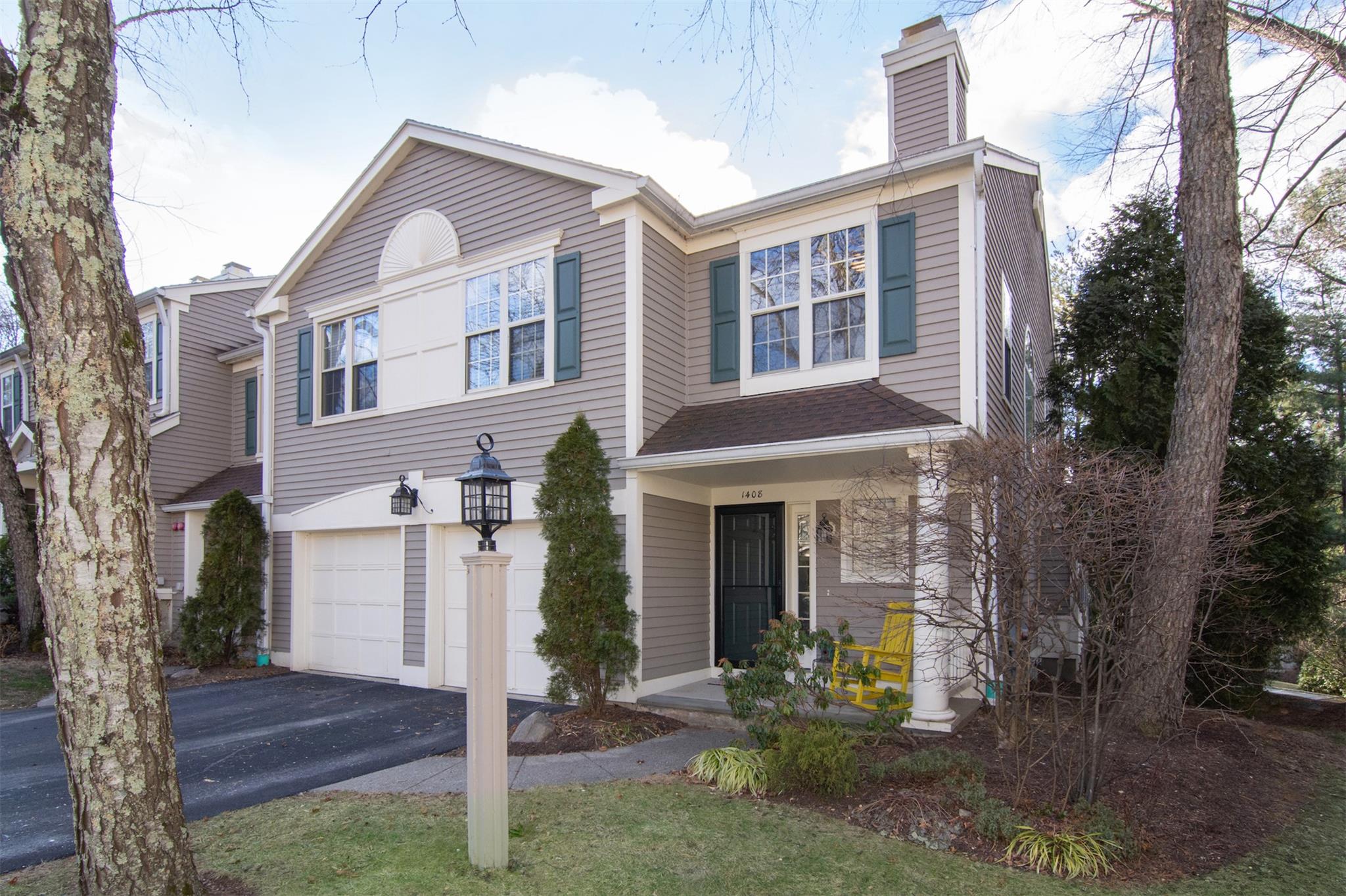 View of front facade with a garage and covered porch