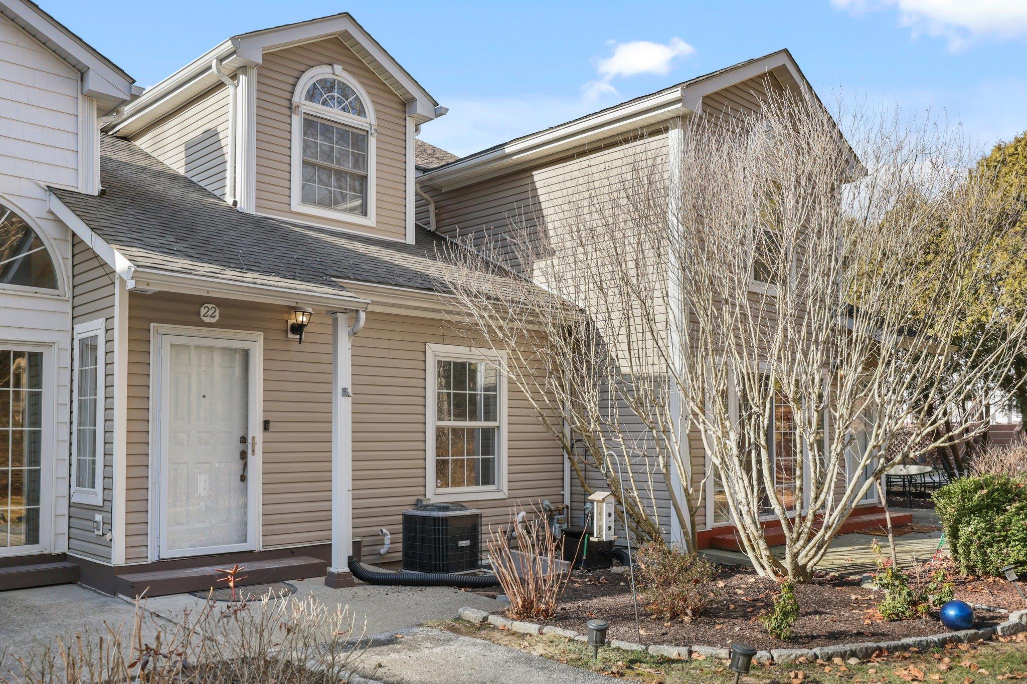View of front of house with central AC