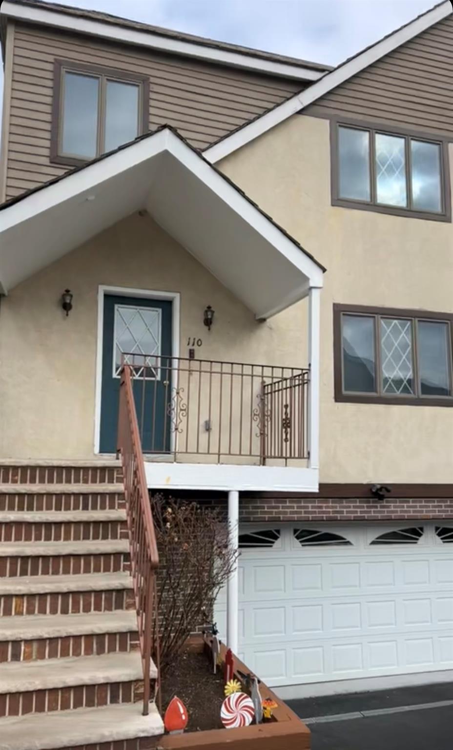 View of exterior entry with a garage