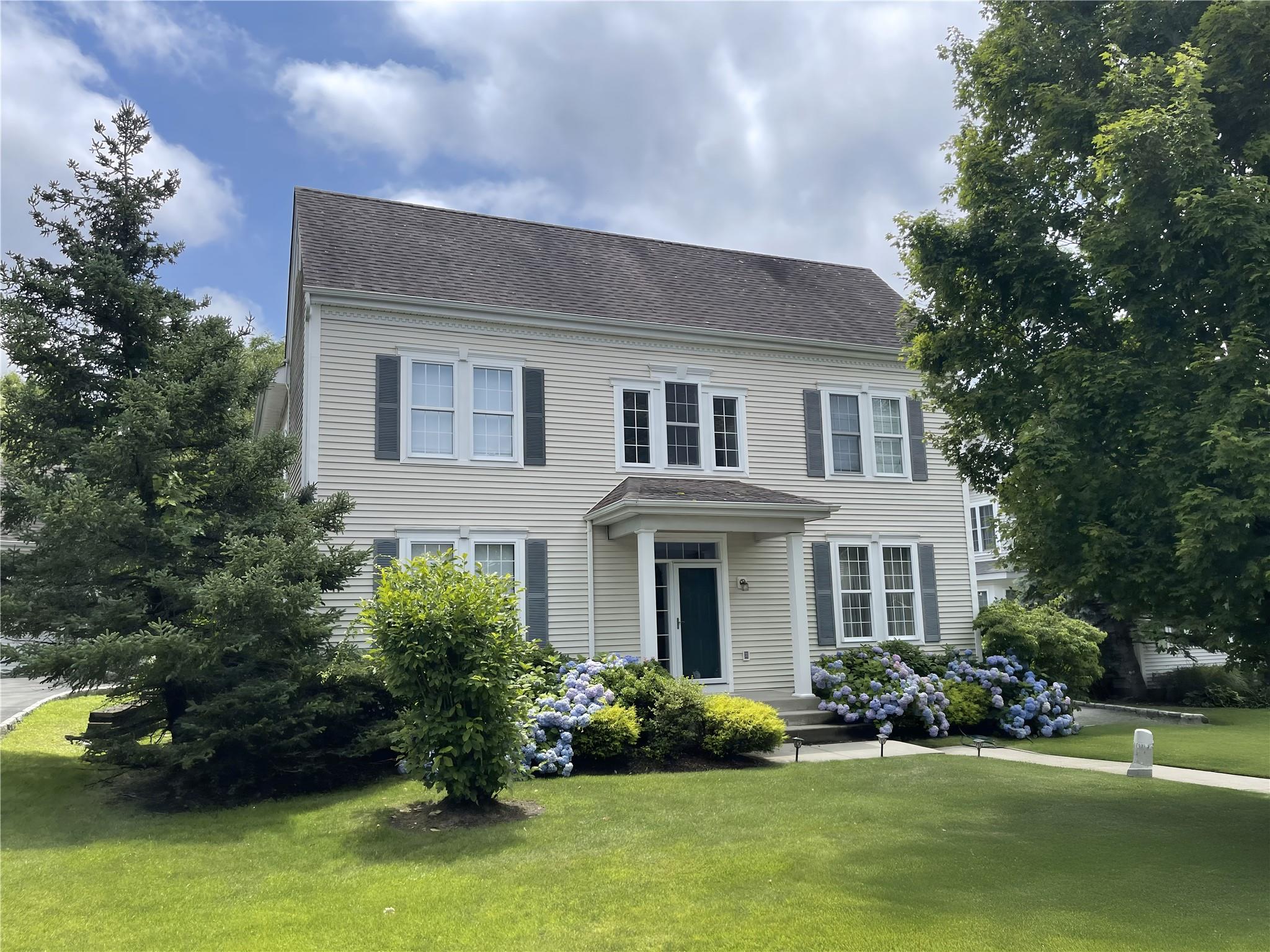 Colonial house with a front lawn