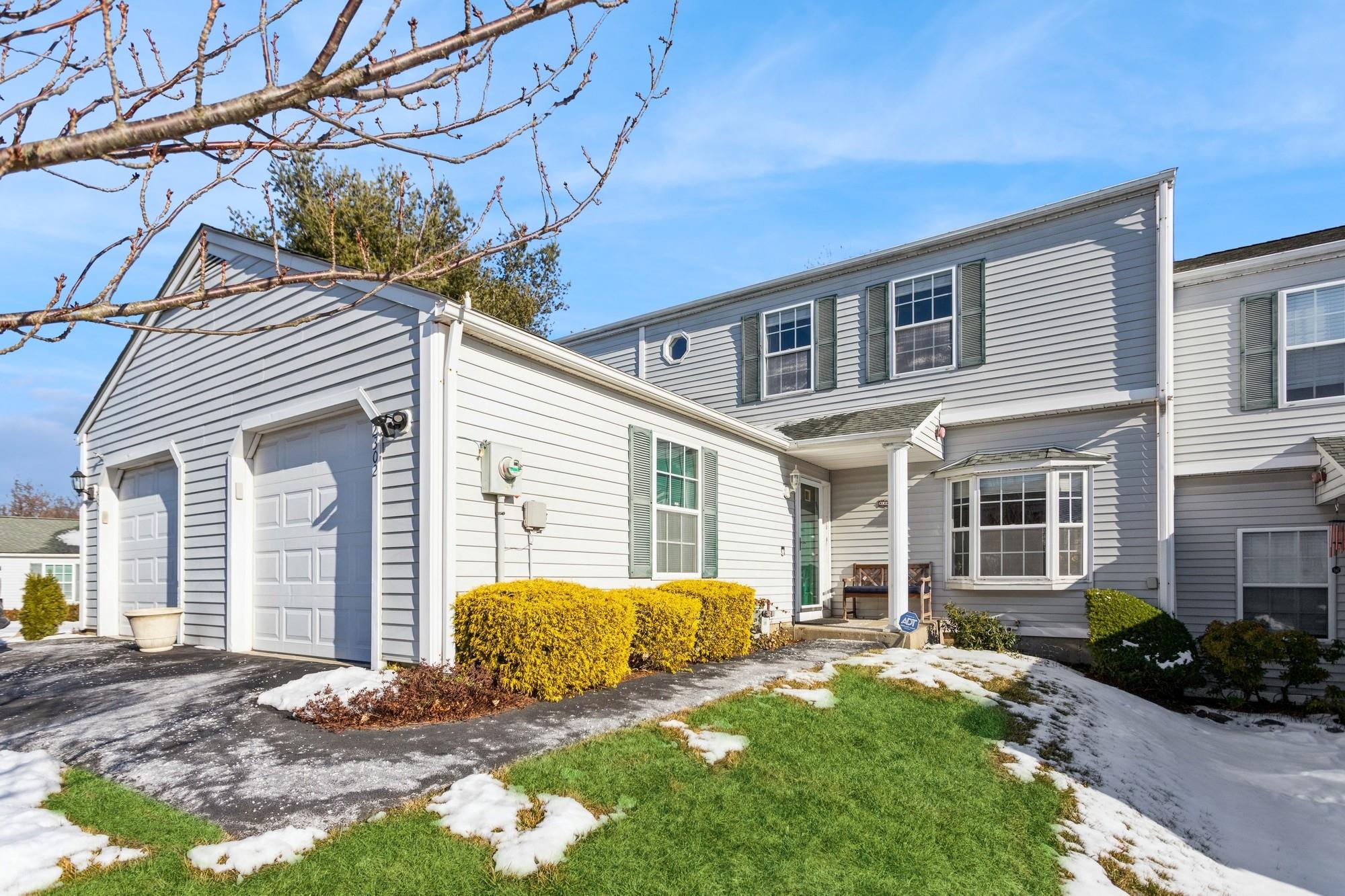 View of property with a garage