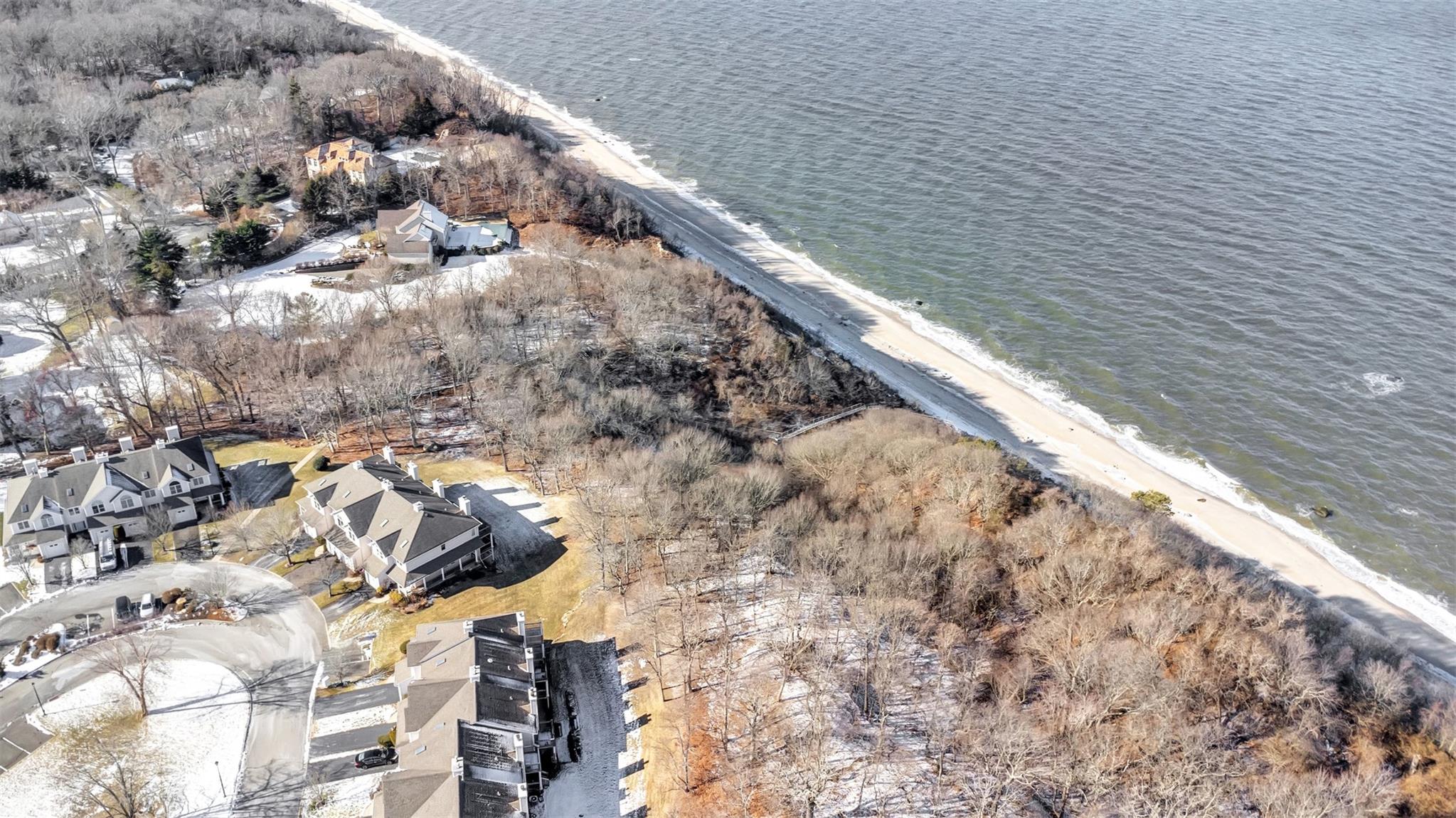 Drone / aerial view featuring the Private Sound Beach.