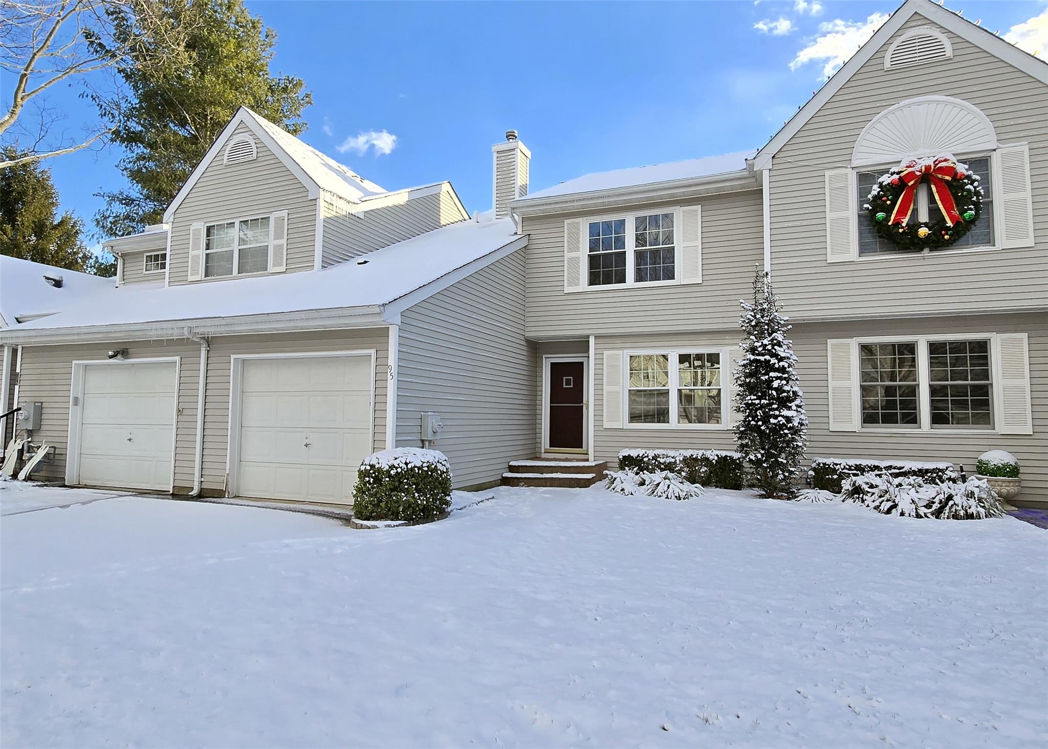 View of front of property with a garage