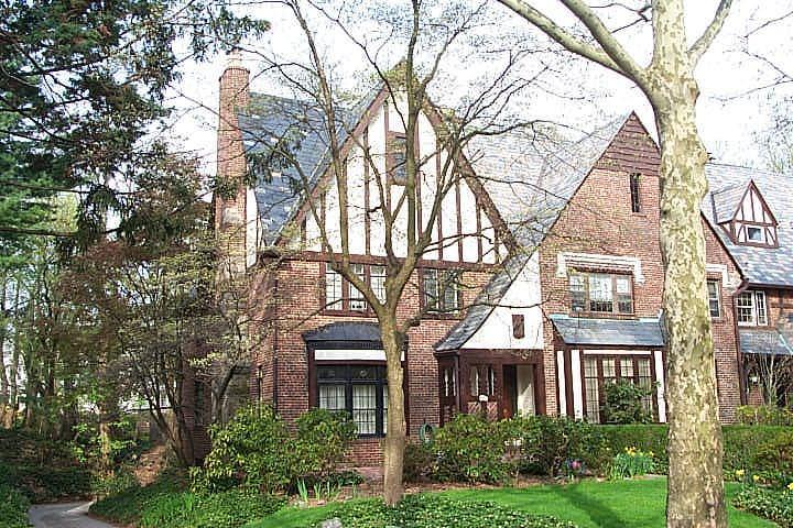 Tudor home featuring a front yard