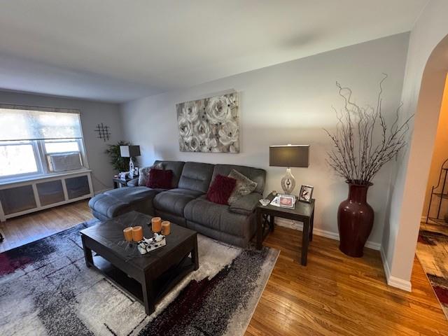 Living room with hardwood / wood-style floors
