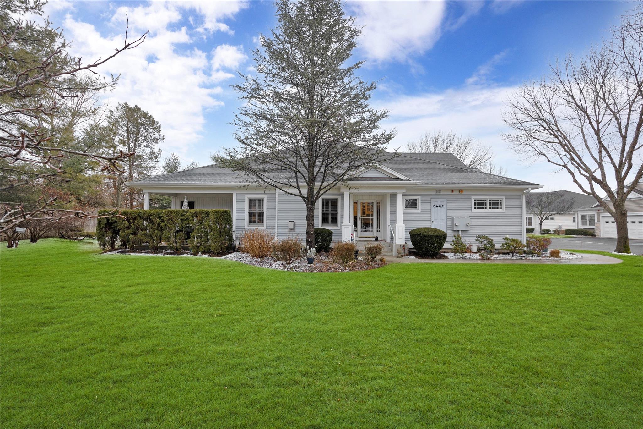 Rear view of house with a yard