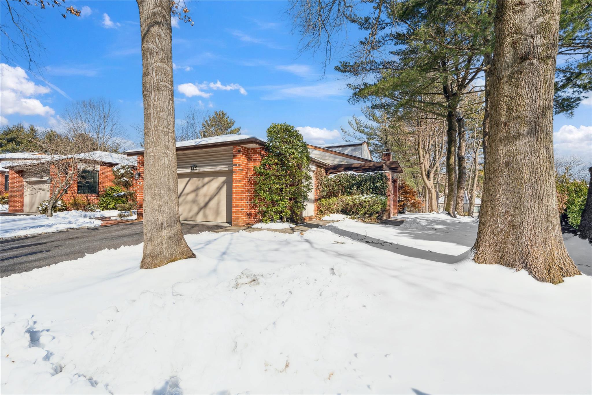 View of front of property featuring a garage