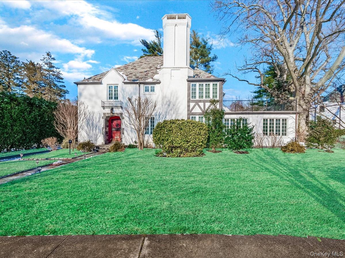 View of front of property with a front yard