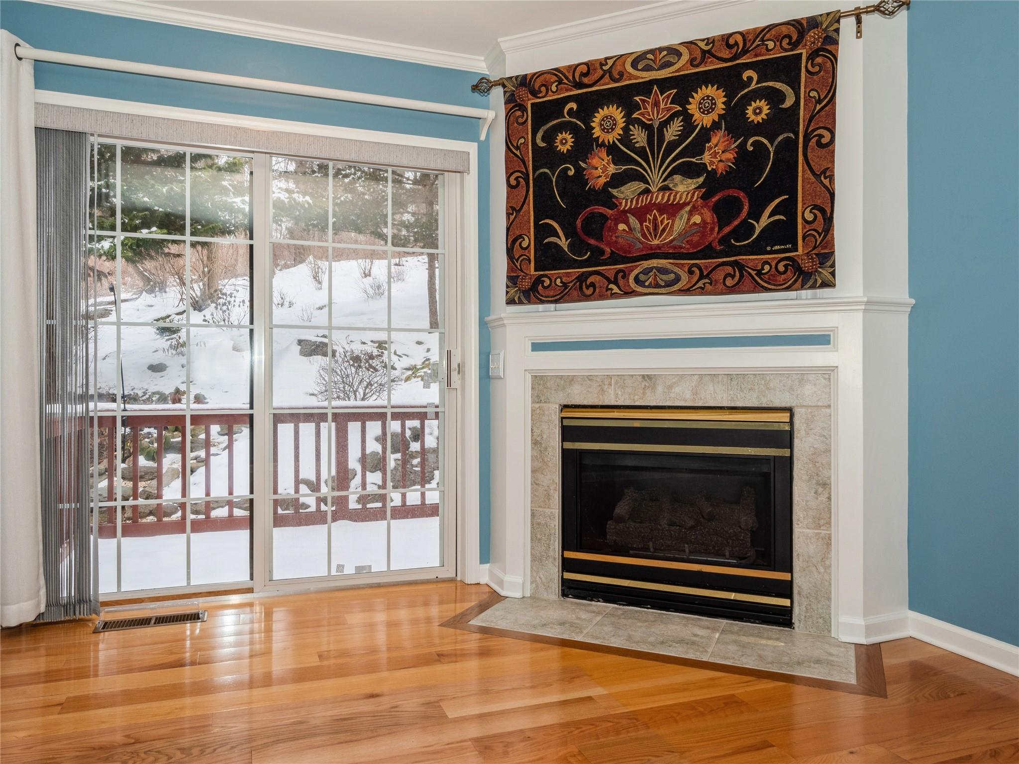 Gas fireplace, access to decking. Hardwood floors