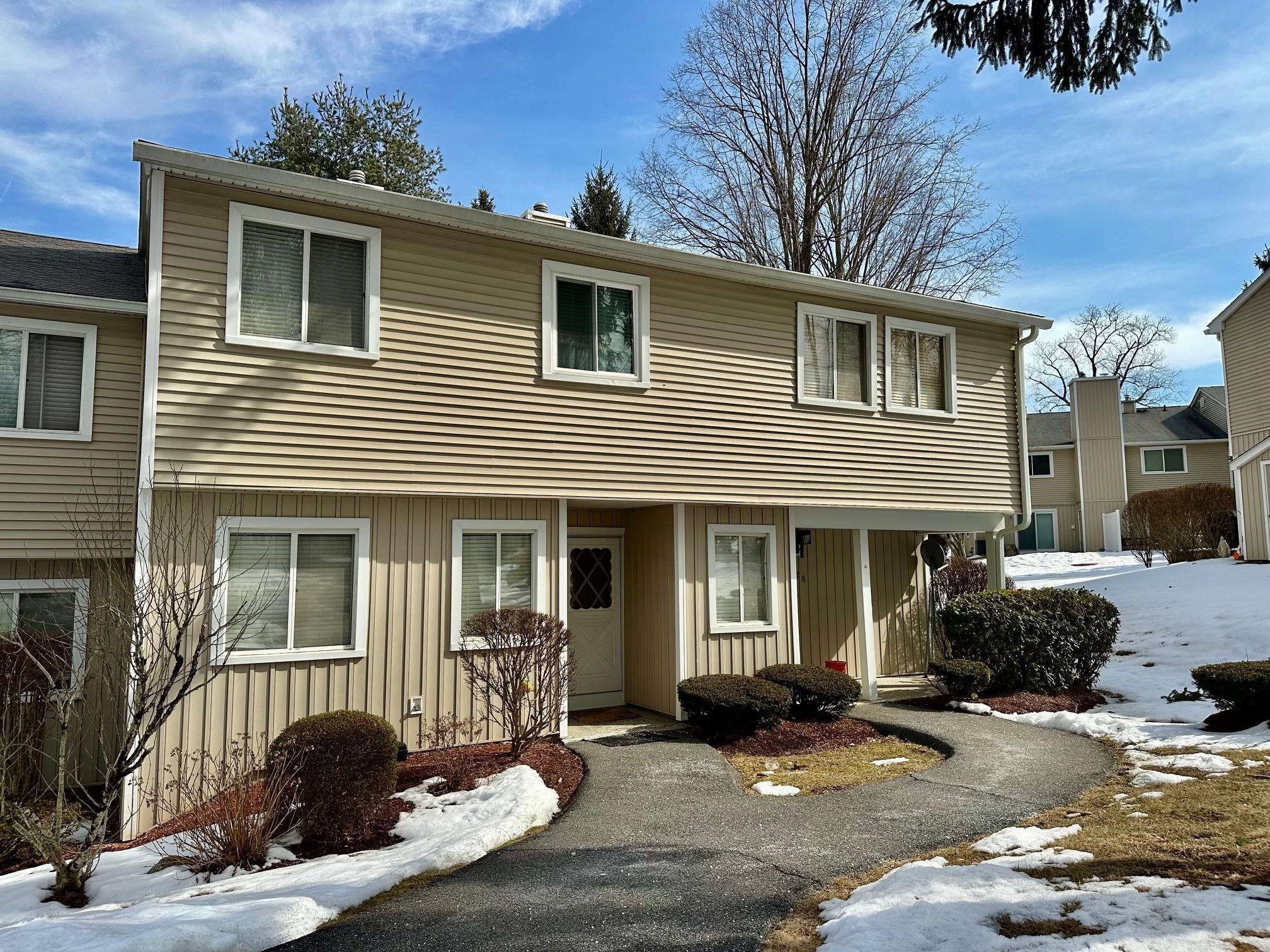 View of front of property with board and batten siding