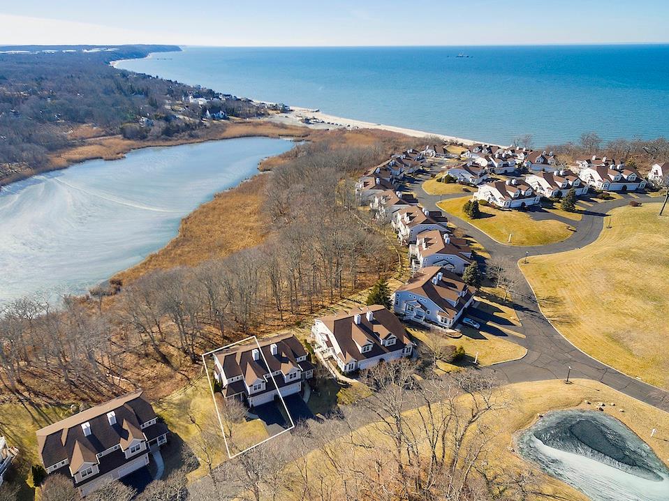 Aerial view with a water view and a residential view