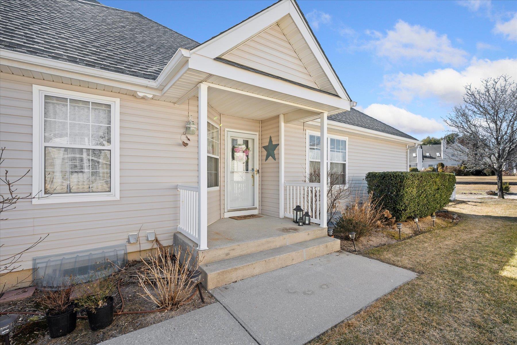 Property entrance with a shingled roof