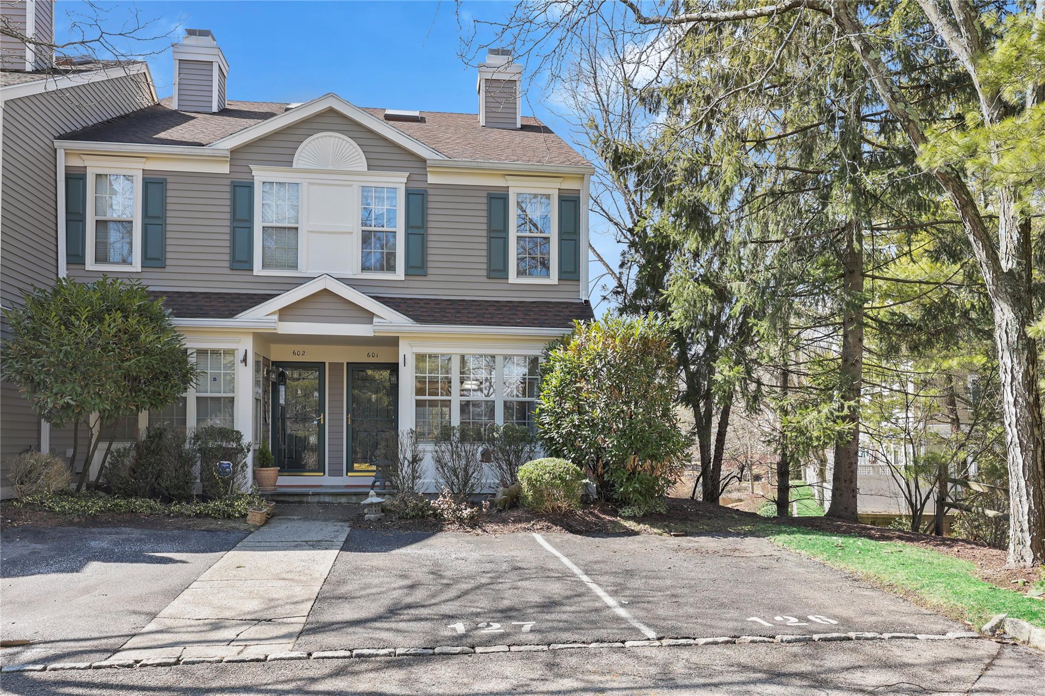Desirable 3-level Expanded End-Unit, 2-bedroom 2.5 bath townhouse, with direct pond views from every level.  The benefit this END-UNIT are more windows and more sunlight! Two parking spaces directly in front of the unit, plus guest parking.