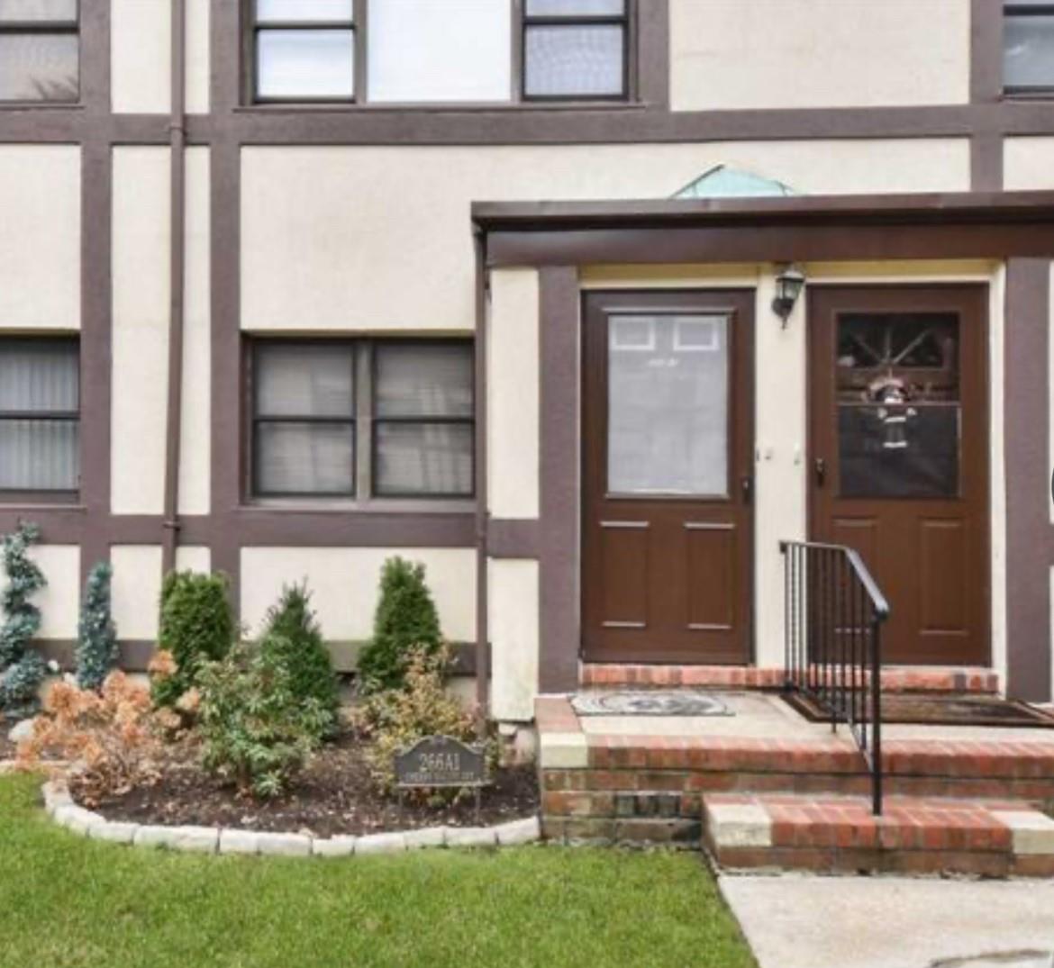 Doorway to property with stucco siding