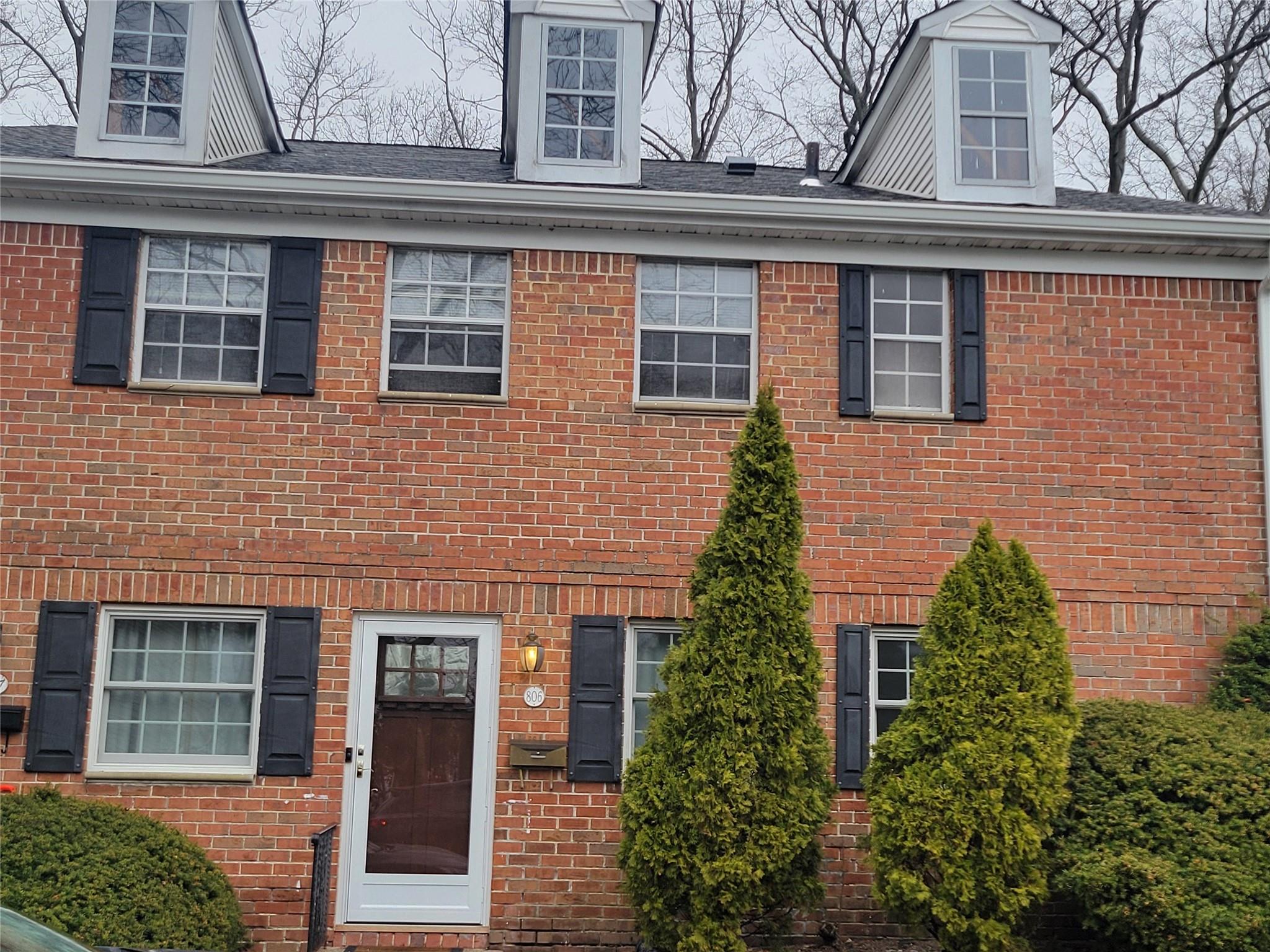View of front of property featuring brick siding