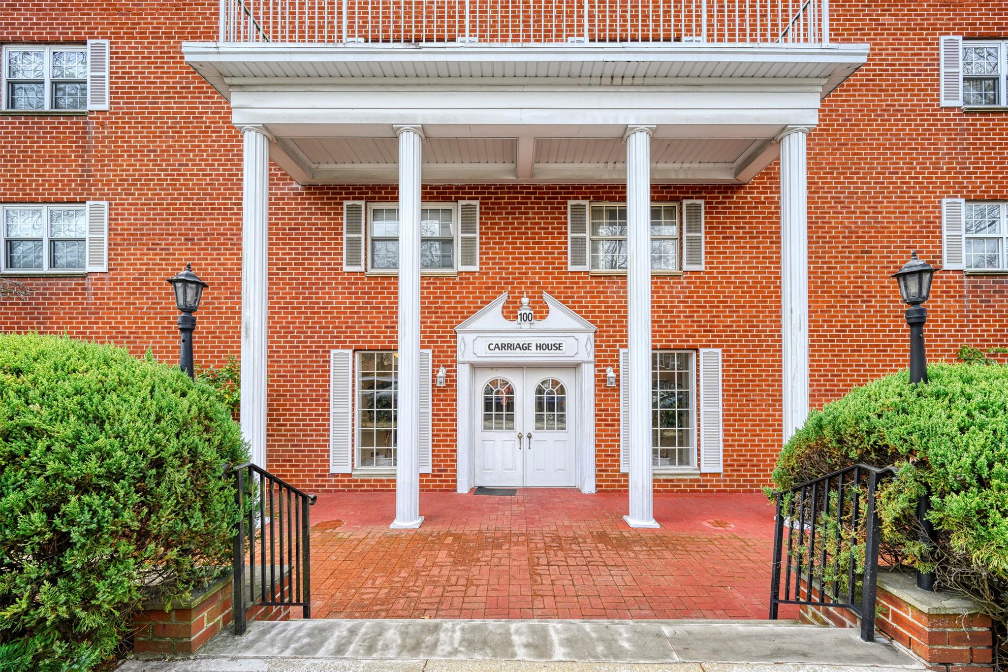 View of exterior entry featuring brick siding